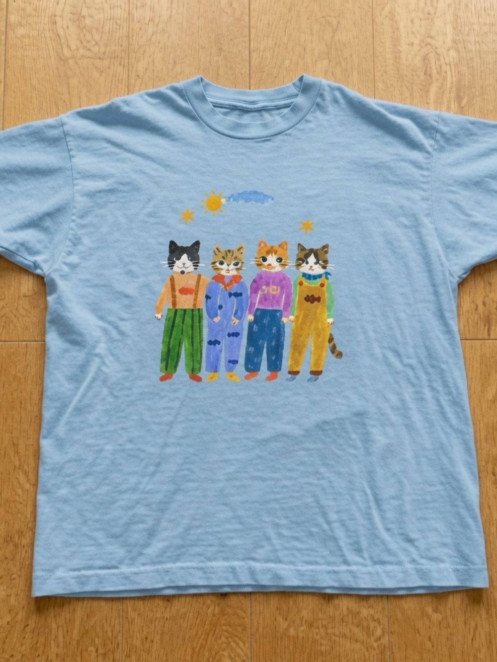 Light Blue T-Shirt with Four Cat Graphic